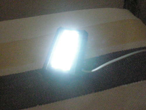 Phone line-powered flashlight
